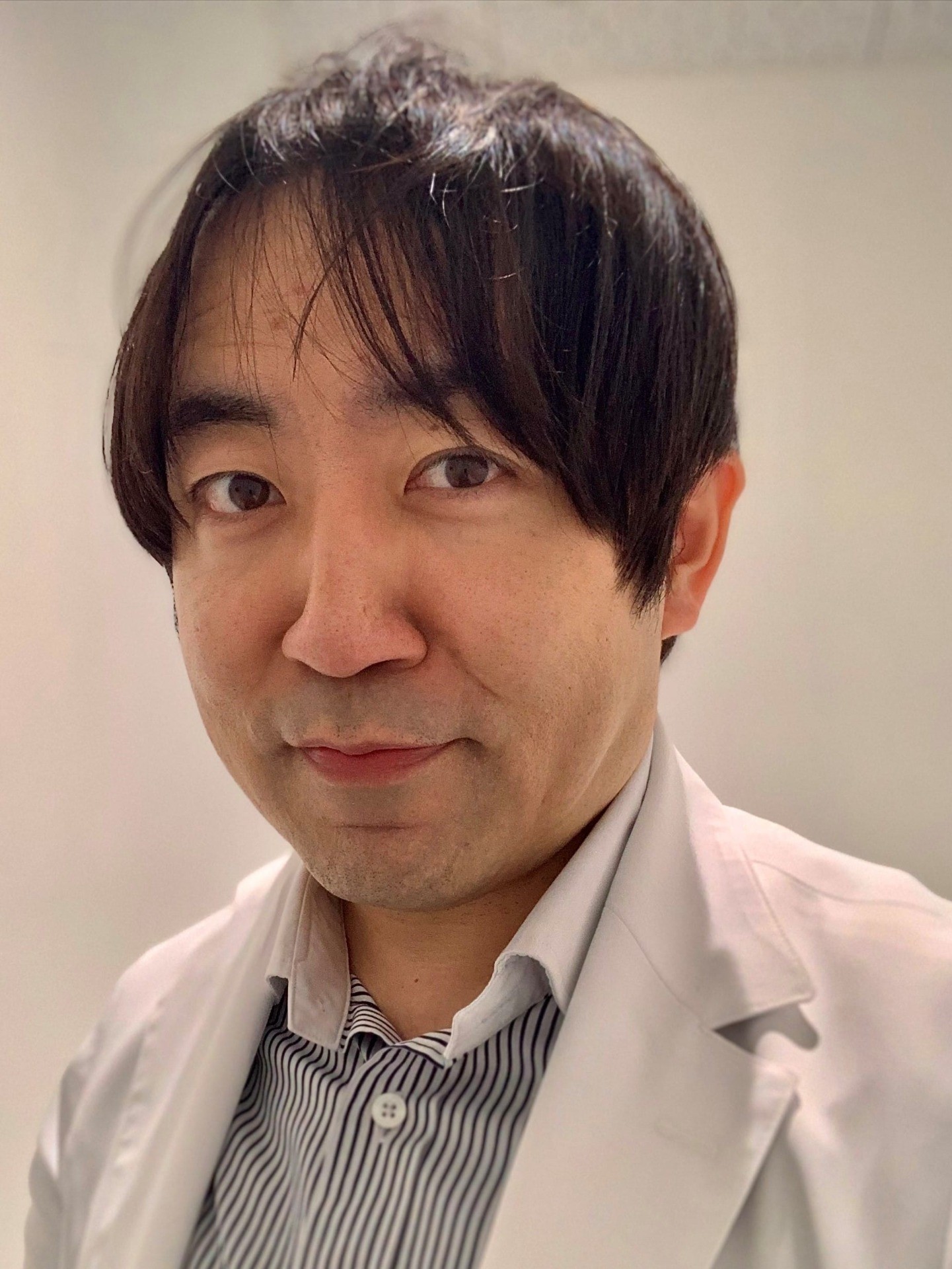 都築 俊介